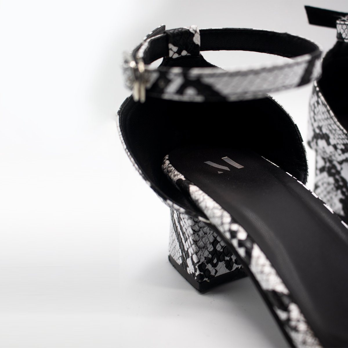 Black & White Snake Low Block Heels by Madish